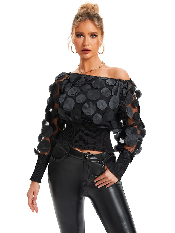 Blouse met schuine schouders en appliqué