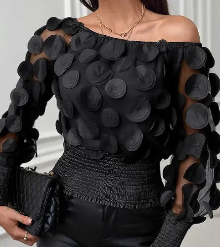 Blouse met schuine schouders en appliqué