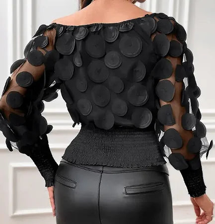 Blouse met schuine schouders en appliqué